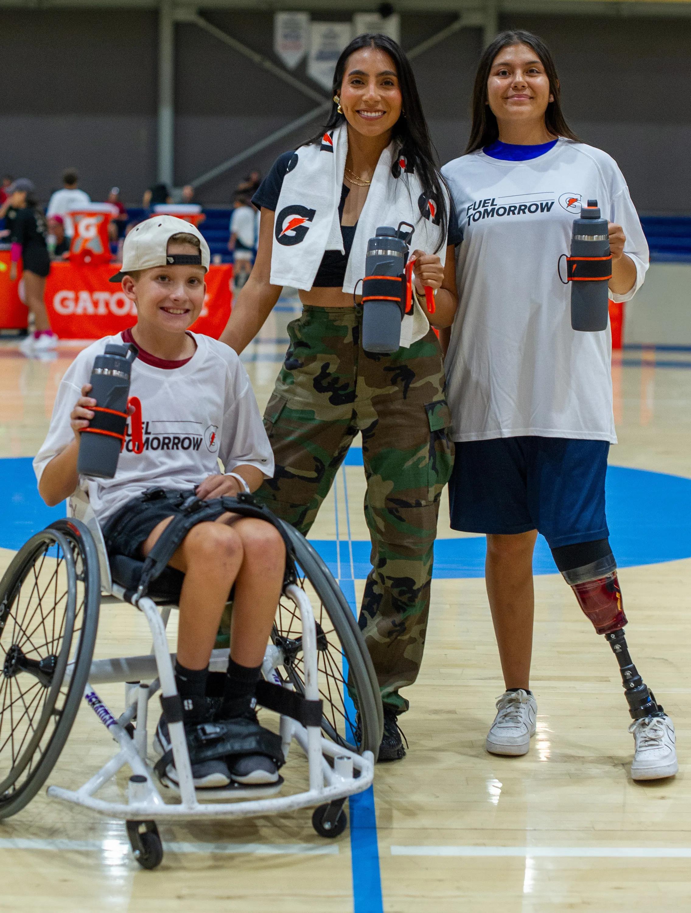 Student-athletes and Diana Flores at the Gatorade Fuel Tomorrow Football Day of Play. 