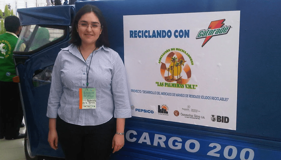 Gaby in front of a recycling transport vehicle PepsiCo provides grassroots recyclers in Peru.