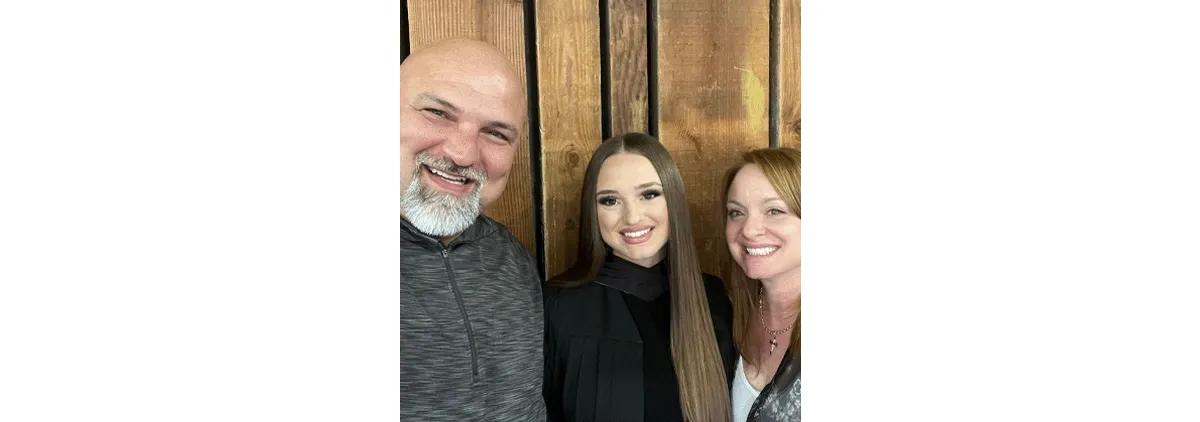 Shaye Burmudzija (center) with her parents Mike and Erin.
