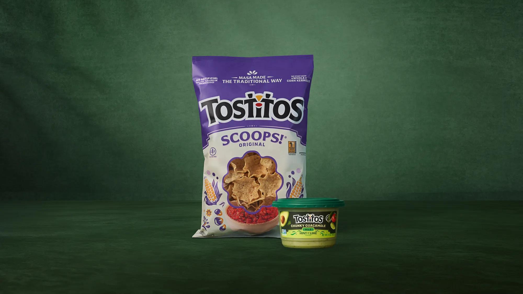 Tostitos® SCOOPS!® Original in refreshed packaging (left) next to new refrigerated Tostitos® Chunky Guacamole: Mild, Hint of Lime Flavored Dip 15 oz. tub (right). Photo credit: Brielle Patton.