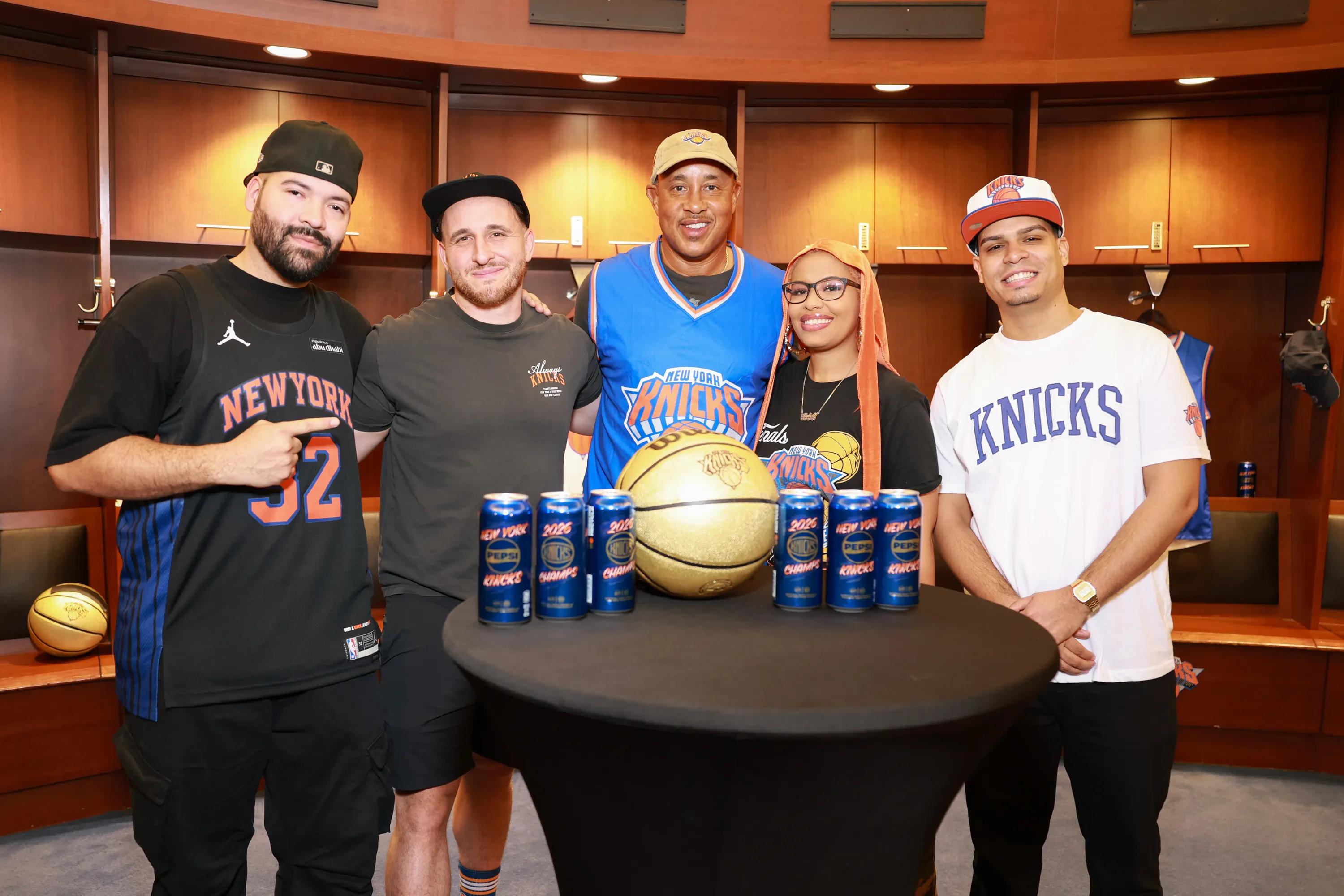 NEW YORK, NEW YORK - SEPTEMBER 30: John Starks poses with fans in the Knicks locker room during the Champions Deserve Pepsi Campaign Launch at Madison Square Garden on September 30, 2026 in New York City. (Photo by Jason Mendez/Getty Images for Pepsi)